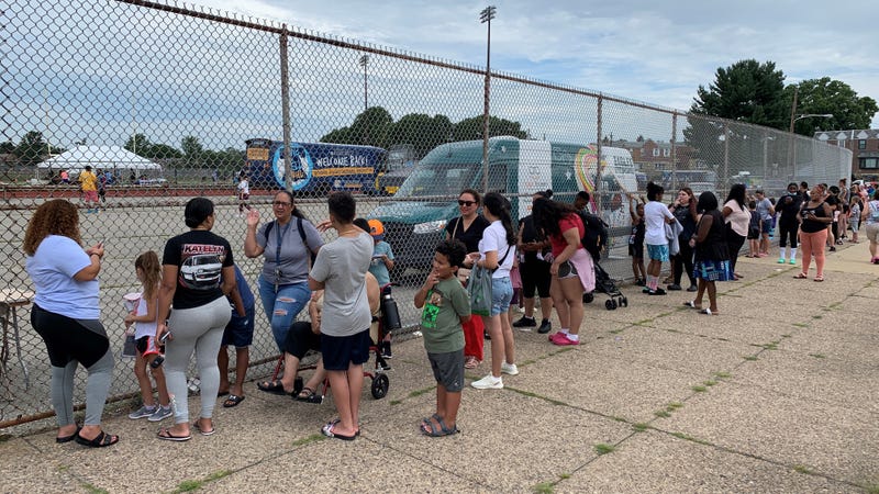 Families waiting in line for free school supplies, backpacks and vaccinations at Northeast High School on Friday.