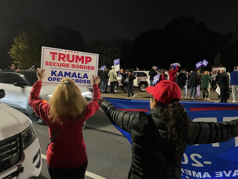 Trump supporters held signs and banners and cheered as drivers honked their horns.