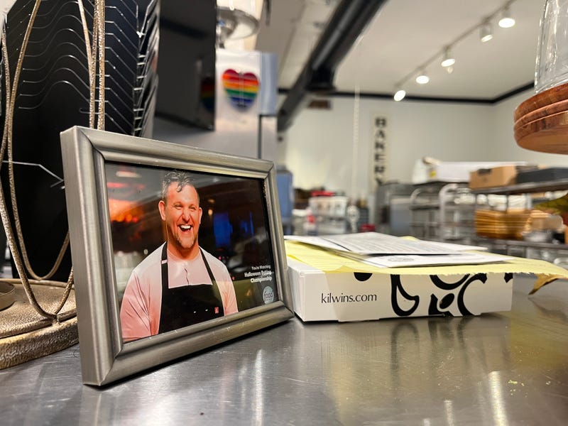 A framed photo of James Cox on Food Network's Halloween Baking Championship