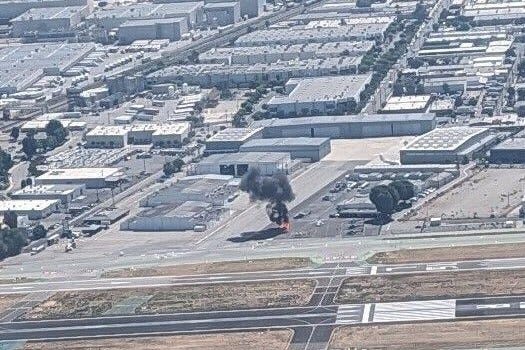 plane on fire at airport