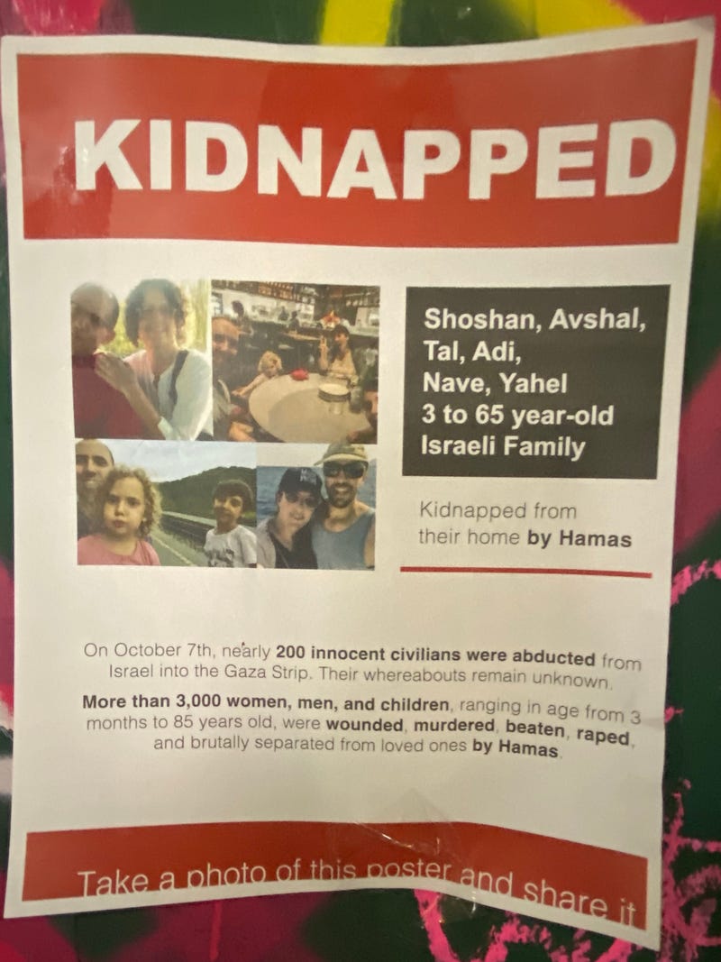 A poster on the SoHo shows a family abducted from their home during Hamas' terror attack in Israel.