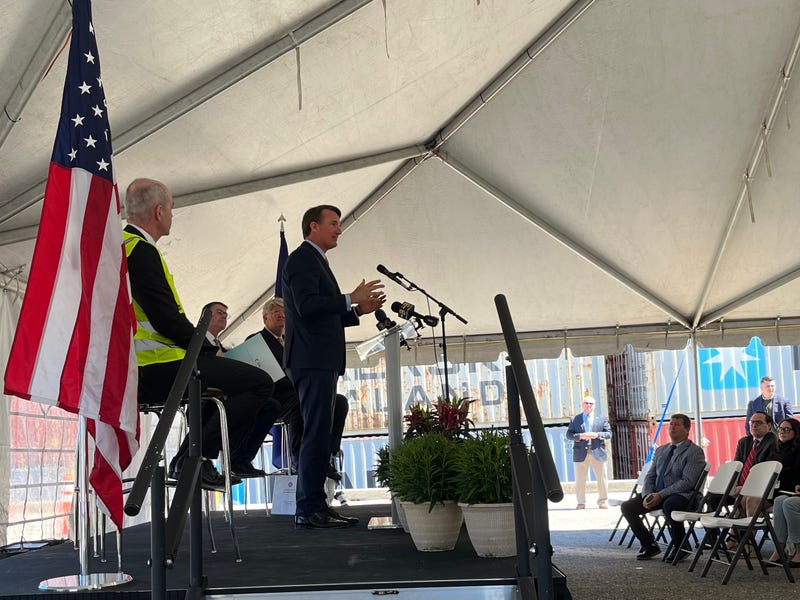 Glenn Youngkin on a podium, addressing a small crowd