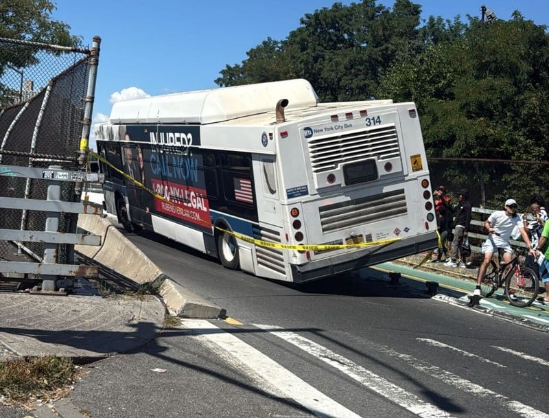 The bus mounted a concrete barrier in University Heights Tuesday