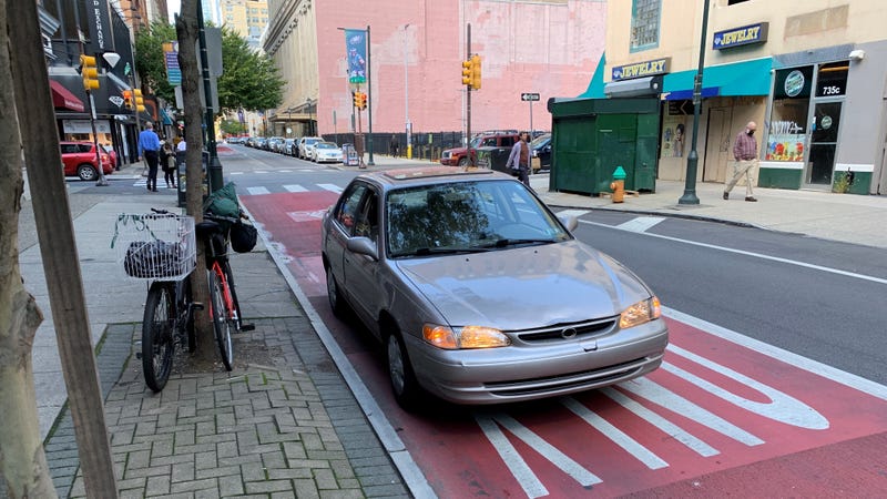 A car parked in a bus-only zone on Chestnut Street in Center City.