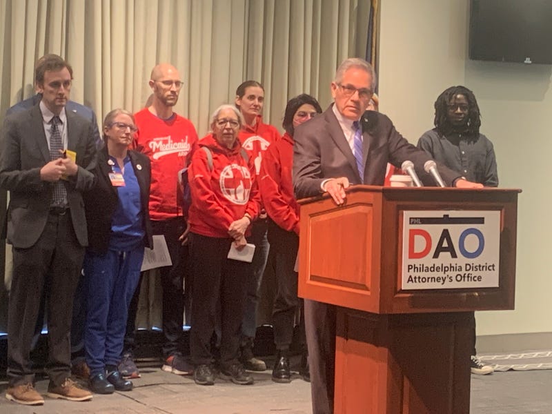 DA Larry Krasner speaking at podium