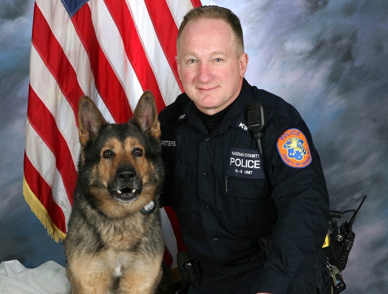 Kai with his handler, officer Chris Peters