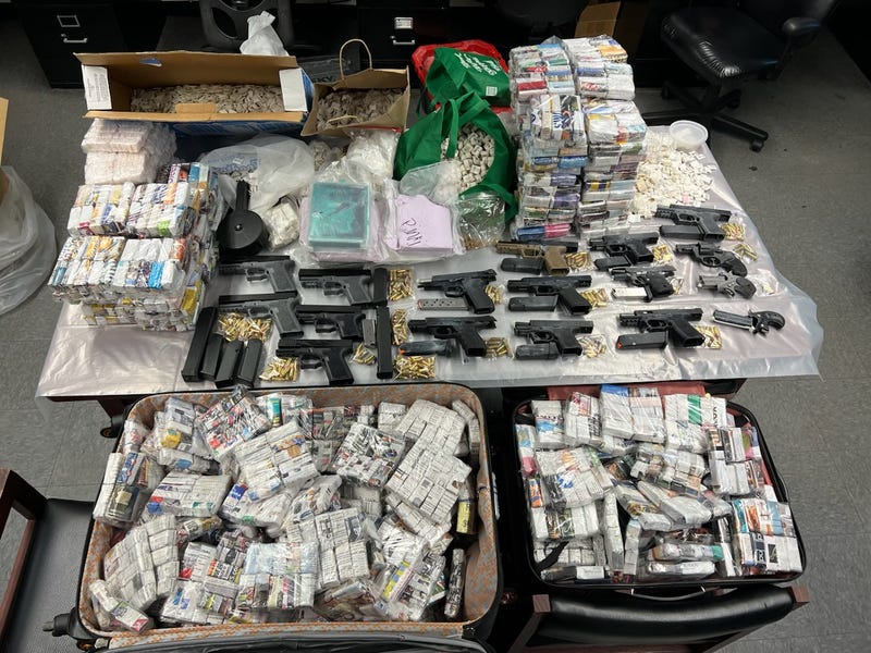 Millions of dollars worth of heroin, fentanyl and cocaine and a stockpile of firearms were found at an abandoned home in Bellerose.