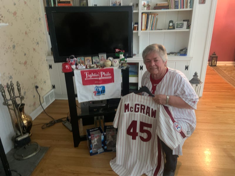 Sr. Linda DeCero by her "shrine" with many Philadelphia Phillies items alongside her religious relics.
