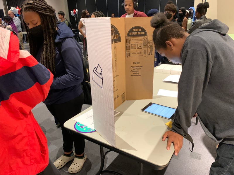 Students at Philadelphia’s Alain Locke Elementary School casting mock ballots for a pair of referendum-like questions as part of a social studies lesson about voting, held at Community College of Philadelphia.