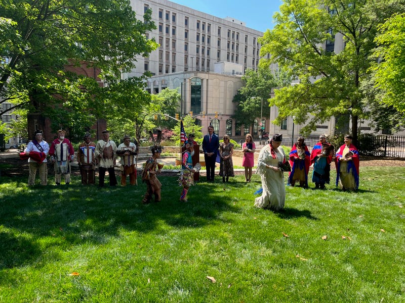A sunny day, Members of the Cheroenhaka Tribe do an Honor Dance for the Governor and First Lady