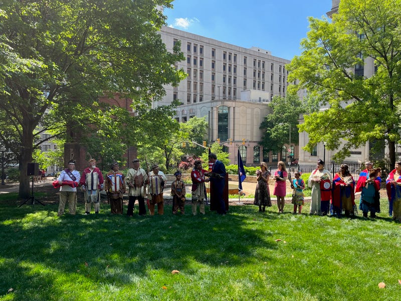 Chief Walt "Red Hawk" Brown presents Governor Youngkin with a wampum belt