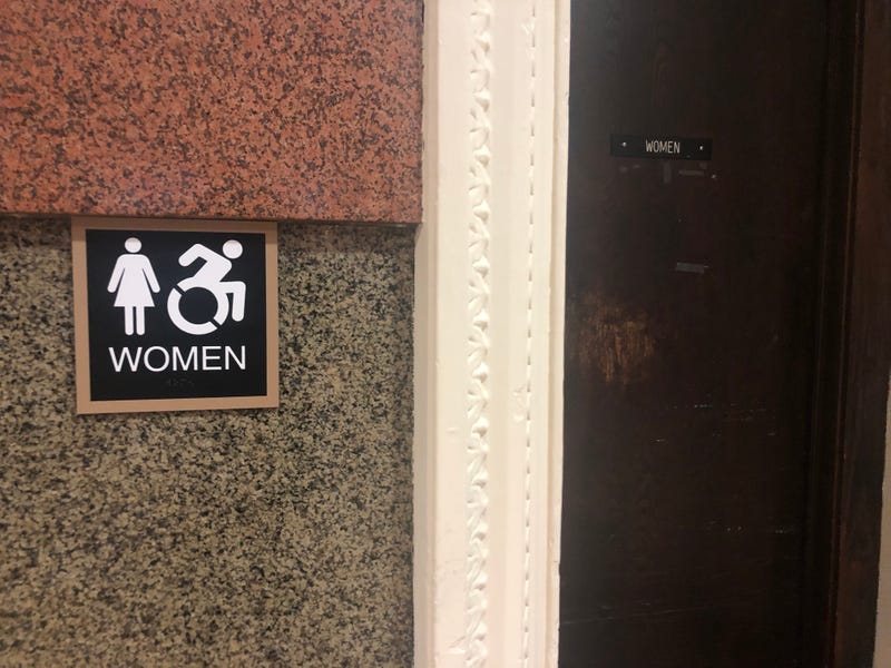 Upgraded sign for a women's restroom at Philadelphia City Hall.