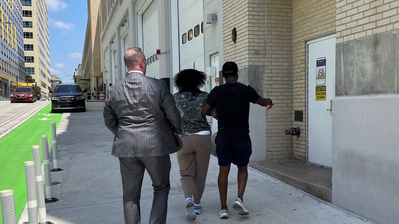 Kianna Casey (center) and her attorney Coley Reynolds as she turns herself in to Philadelphia police Tuesday.