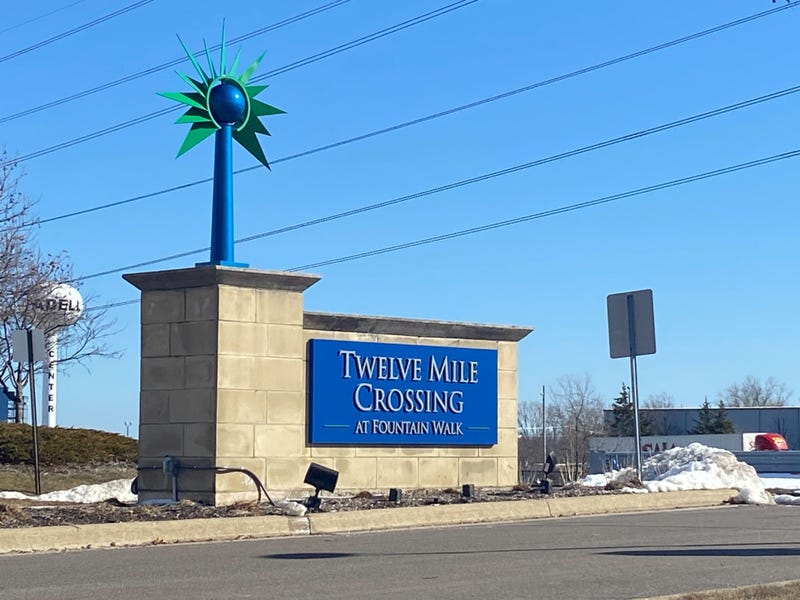 Twelve Mile Crossing at Fountain Walk sign