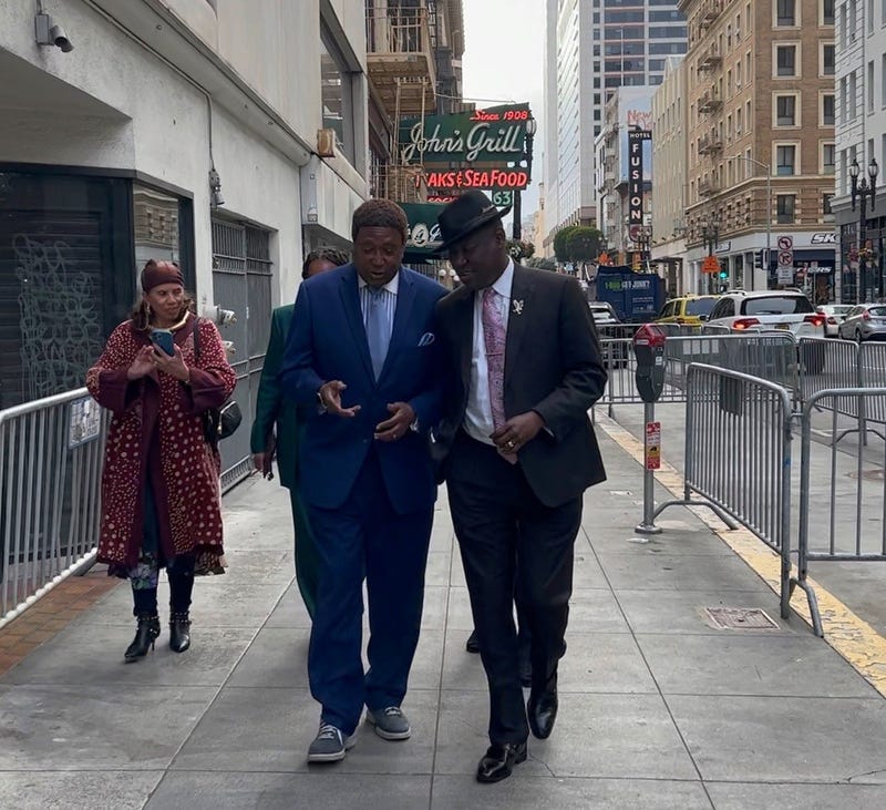Civil rights attorney Ben Crump (R) is speaking out, calling the killing of Brown unjustified. John Burris (L) is representing Brown’s family in a potential civil case.