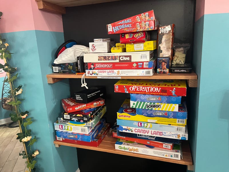 A selection of board games at Nitro Nostalgia for customers to play while enjoying their ice cream. Garland and Kamillah Lucas said they want the shop to act as a community space for neighbors in Bronzeville. 