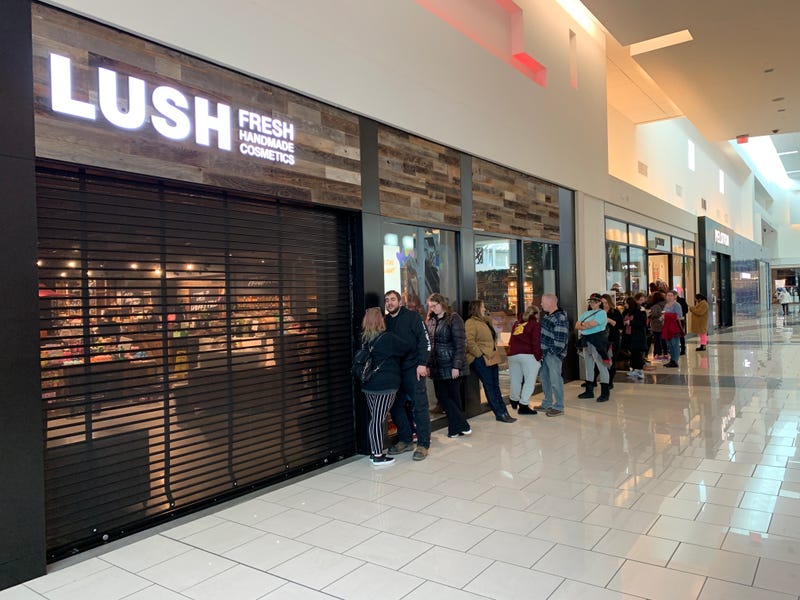 Before the Lush cosmetics and soap store opens at the Cherry Hill Mall, a line of customers forms outside for its once-a-year Boxing Day sale.