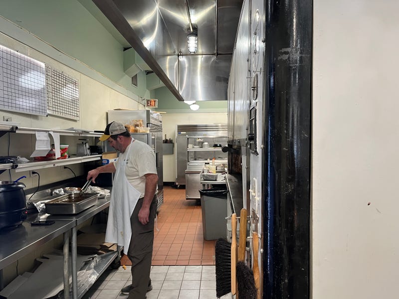 Craig Rutherford works the kitchen at Bojono's Express