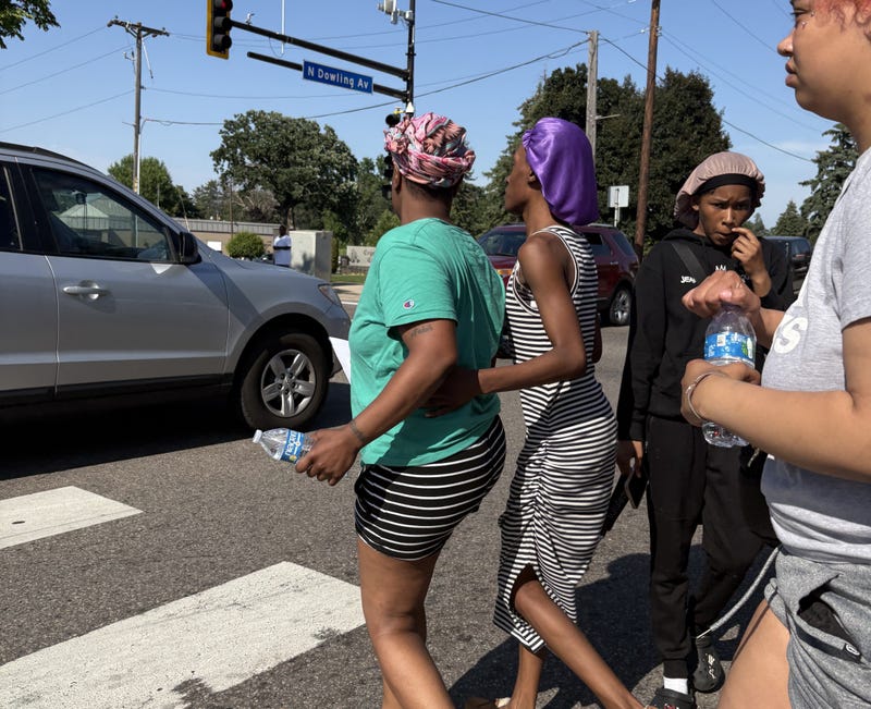 The mother of 11-year old Amir Lamar Atkins near where he was shot and killed in north Minneapolis Monday afternoon.