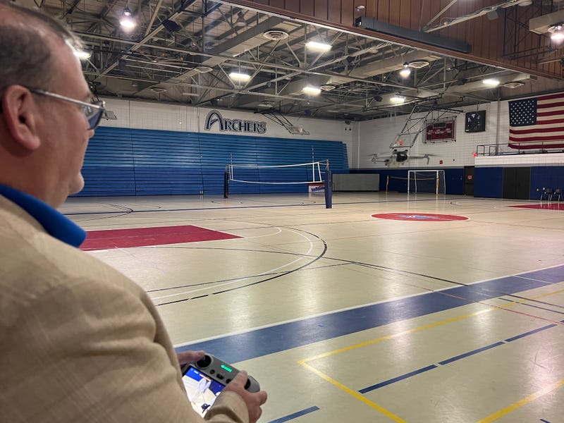 STLCC-Florissant Valley STEM Dean Tom McGovern pilots a drone in the school's gymnasium