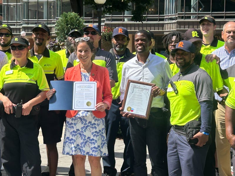 The city's Downtown Improvement District is marking a successful year and Mayor Melvin Carter (center) remains optimistic about the city's future.