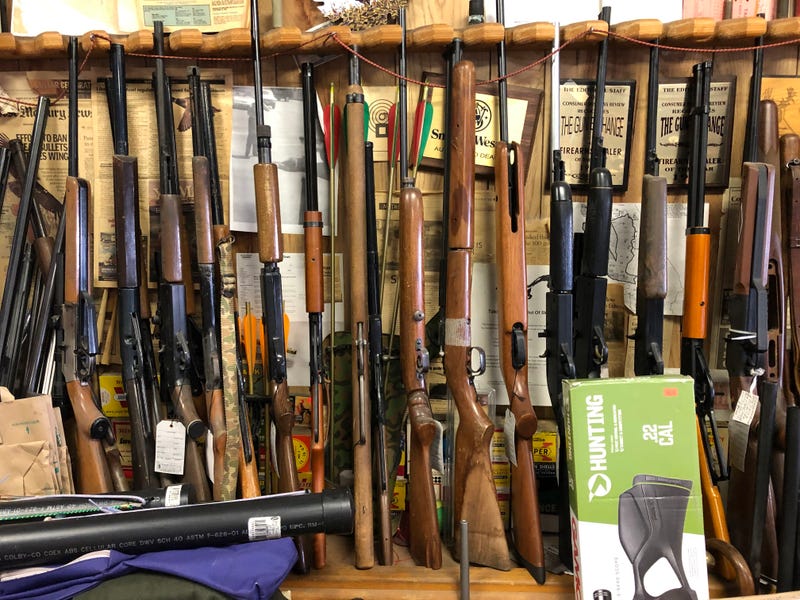 Rows of rifles displayed at Gun Exchange in San Jose.