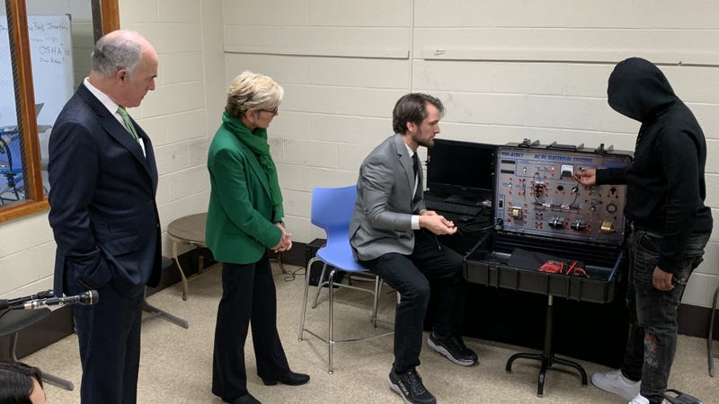 U.S. Sen. Bob Casey, Secretary of Energy Jennifer Granholm and teacher Jordan Crawley with a student.