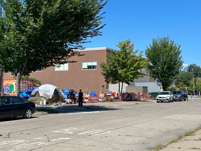 A homeless encampment in Minneapolis that's on privately owned land on East Lake Street is setting up a showdown between the owner and the city.