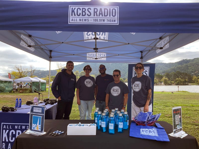 KCBS Radio's Mike DeWald, Claire Beverly, Joe Hawkes-Beamon, Don Bastida, and Danae Labrana (left to right) set up at Ember Stomp 2025.