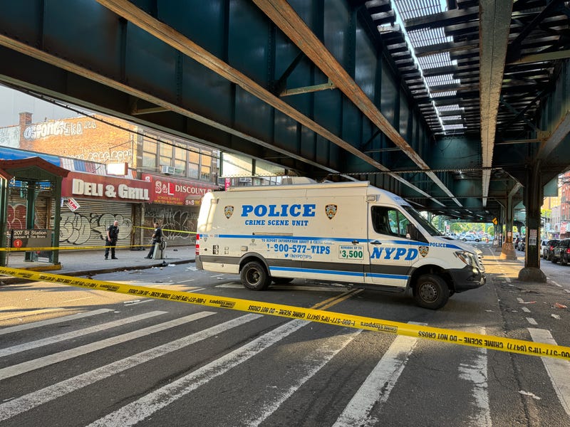 Police at the scene of the shooting near the 207th Street station