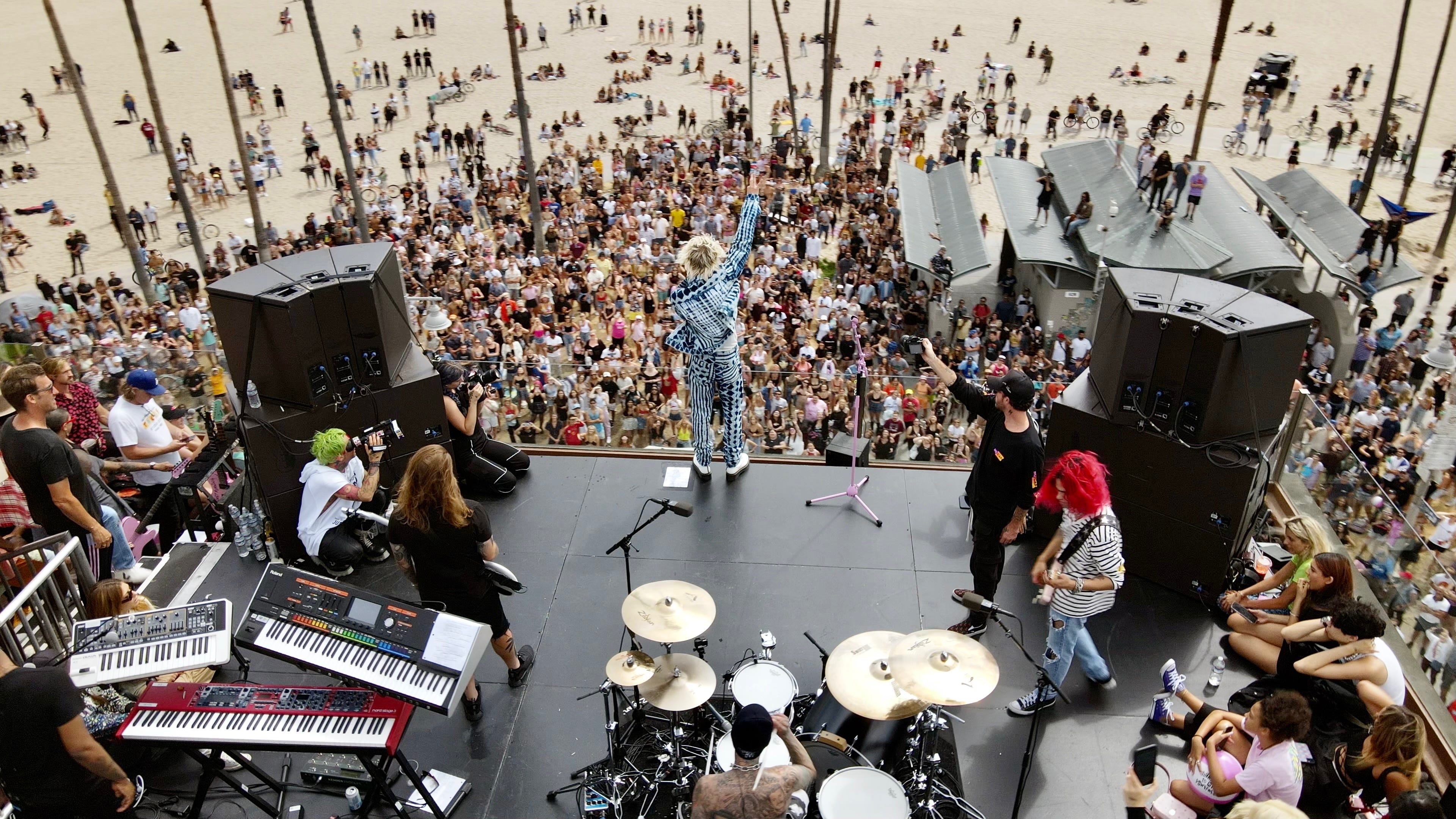 Machine Gun Kelly and Travis Barker play surprise set on Venice Beach rooftop