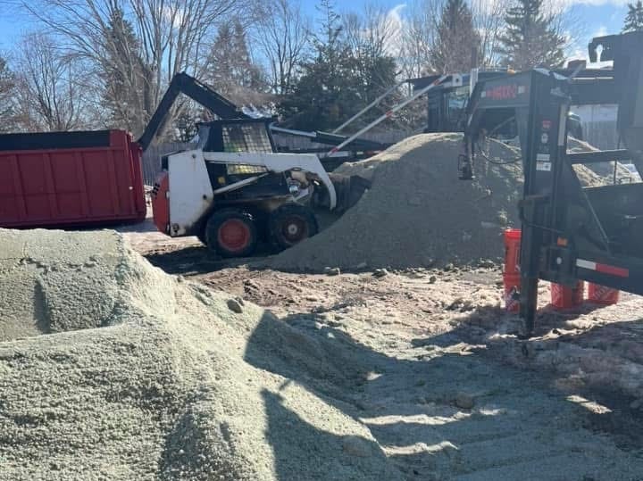 A loader preparing rock salt for public sale at N.E. Bretherton in Clarence