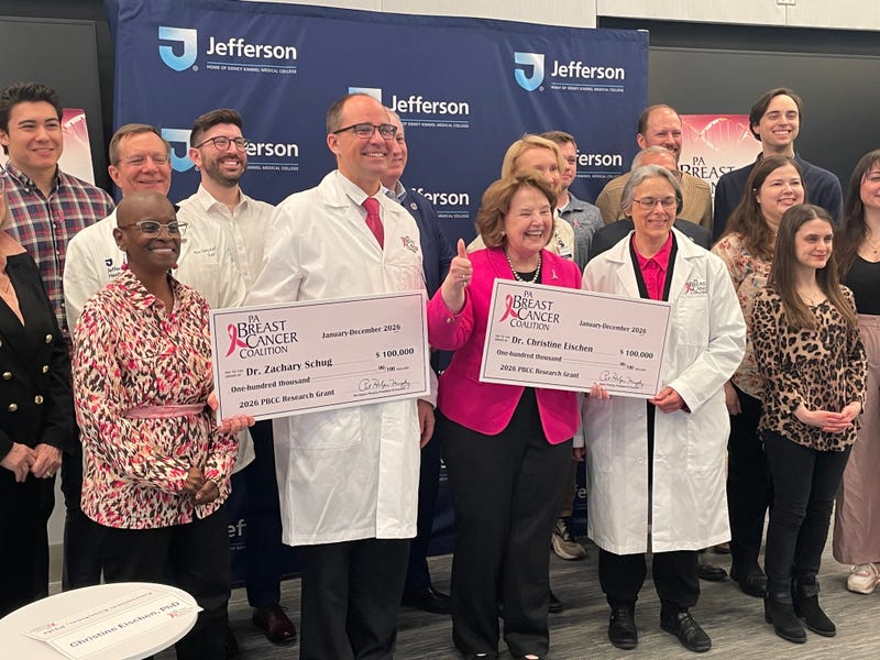 PA Breast Cancer Coalition President Pat Halpin-Murphy (center) awards $100,000 grants to Dr. Zachary Shrug and Dr. Christine Eischen for their research into immunotherapy and triple-negative breast cancer.