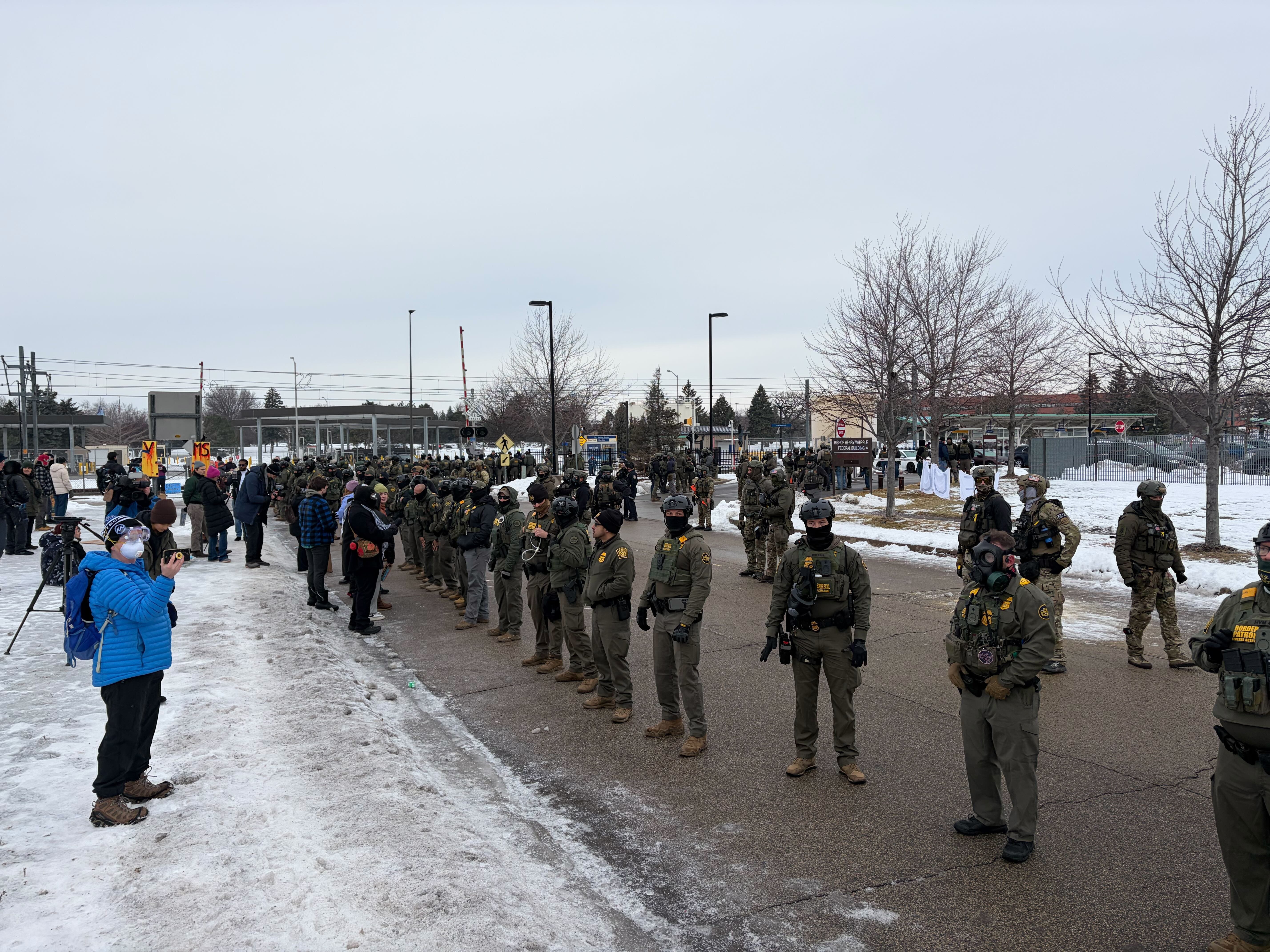 Federal officials and protesters clash briefly at Whipple Building at Fort Snelling early Thursday
