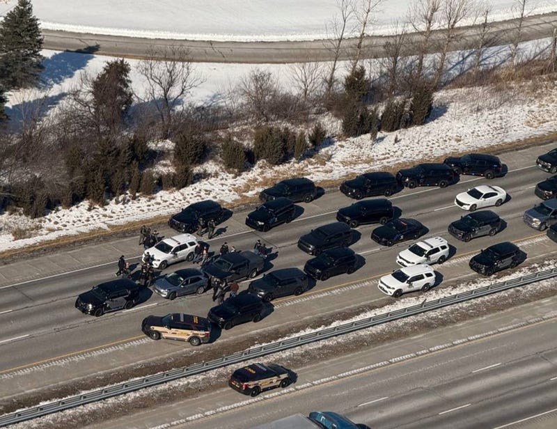 police vehicles surround suspect and his vehicle
