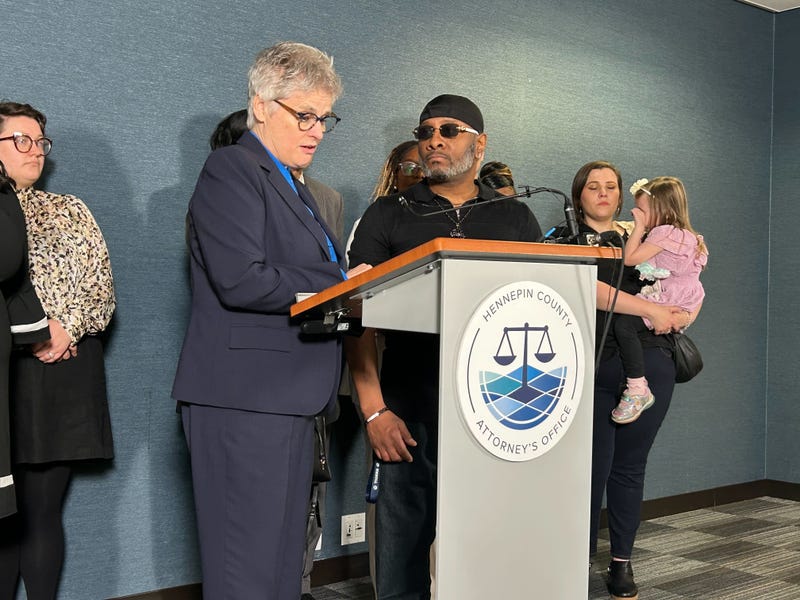 After nearly three decades in prison, Brian Hooper, right standing next to county attorney Mary Moriarty, was exonerated after a key trial witness confessed to the crime during an investigation by the county's Conviction Integrity Unit.