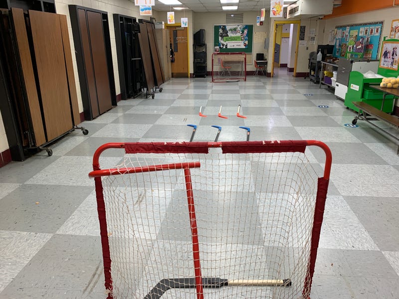 An indoor space at John Moffet Elementary in East Kensington is transformed into a makeshift street hockey rink.
