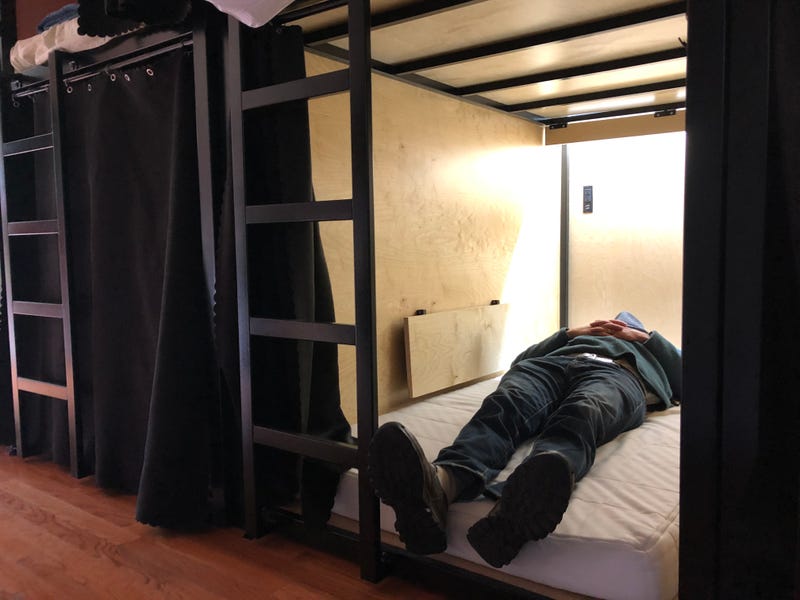 A resident lying down in one of the pods at the house in Palo Alto.