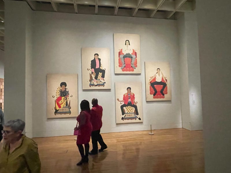 Art Museum visitors take in the pieces at the Shape of Time exhibit.