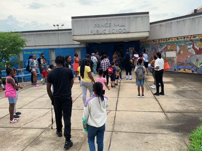 Students and parents arrive at Prince Hall elementary for the first day of summer enrichment classes in Philadelphia.