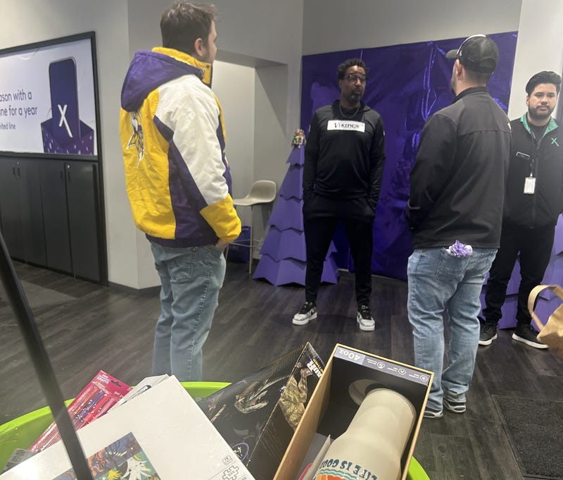 Vikings legend Chris Carter attends Eagan toy drive and recalls being on the receiving end of holiday help.