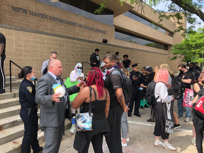 New Haven Assistant Police Chief Karl Jacobson (L, in suit) meets with city residents, 6/3/20 (Jacobson became police chief in July, 2022)