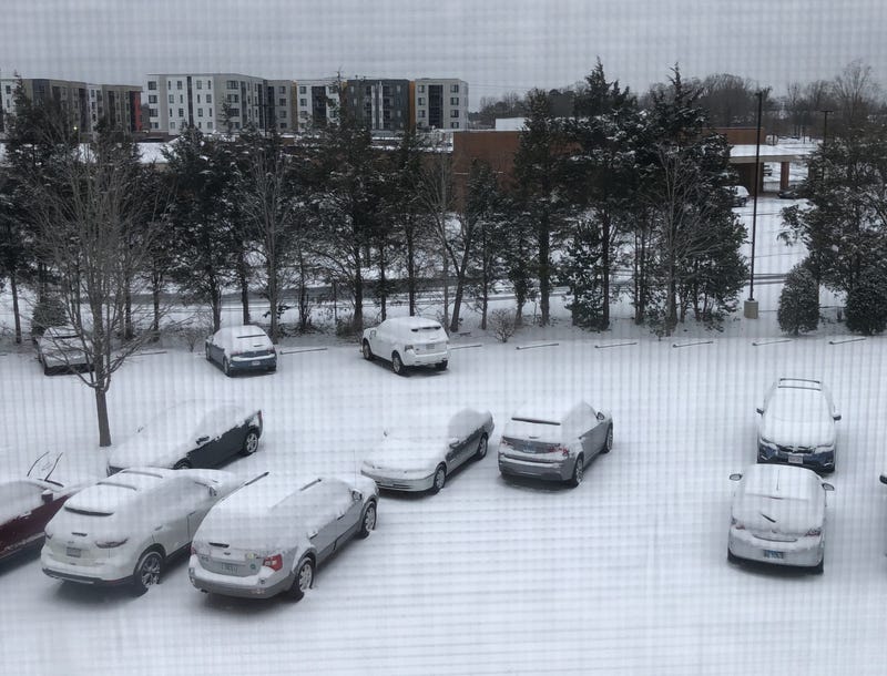 Snowy parking lot, from a second story window