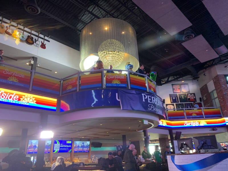 Gov. Josh Shapiro stands with Philly mascots during FIFA world cup drawing