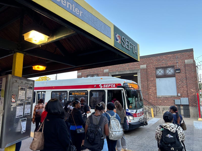 Riders board a SEPTA bus at the Wissahickon Transit Center on Aug. 26, 2025. A 20% reduction in SEPTA service took effect on Aug. 24.