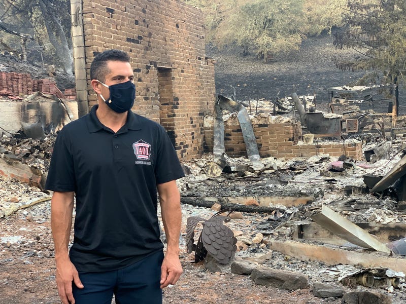 Santa Rosa Fire Captain Mike Musgrove stands in the ruins of his new home, burned to the ground by the Glass Fire as he fought the same flames just miles away.