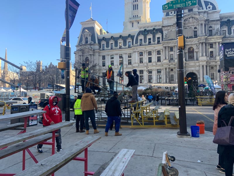 Crew set up bleachers outside City Hall on Friday.