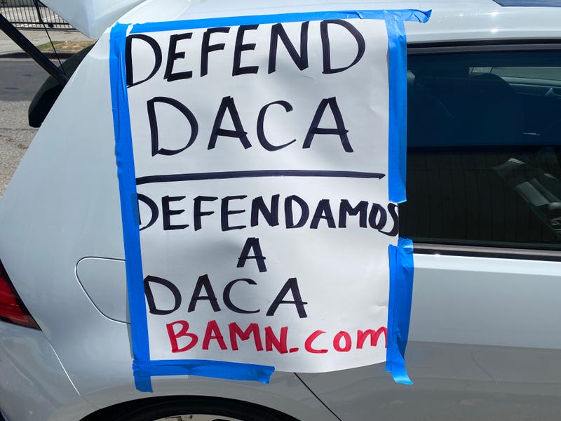 Signs on a car calling to defend DACA.