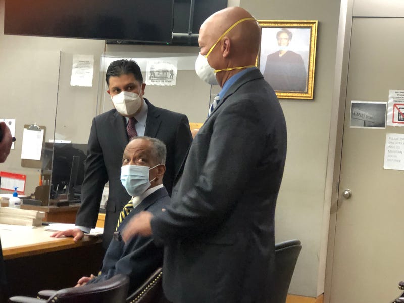 Mallory Nicholas (seated) meets Dallas County District Attorney John Creuzot before a hearing on Thursday, June 2, 2022.