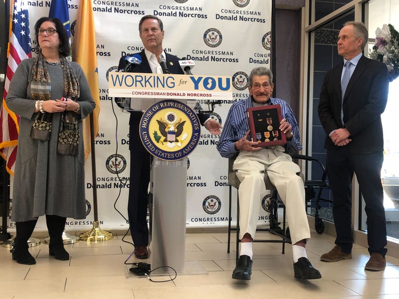 Congressman Donald Norcross presents World War II veteran Gilbert Klein with medals at a ceremony in Haddon Township, New Jersey, on Dec. 3, 2024.